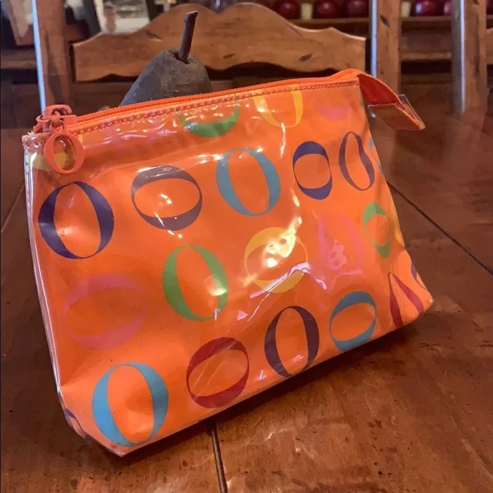 Never used Rare Oprah Orange O Logo Cosmetic bag.